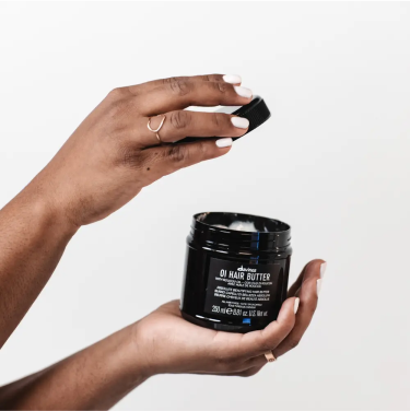 Hydrating hair mask being applied to dry, damaged hair