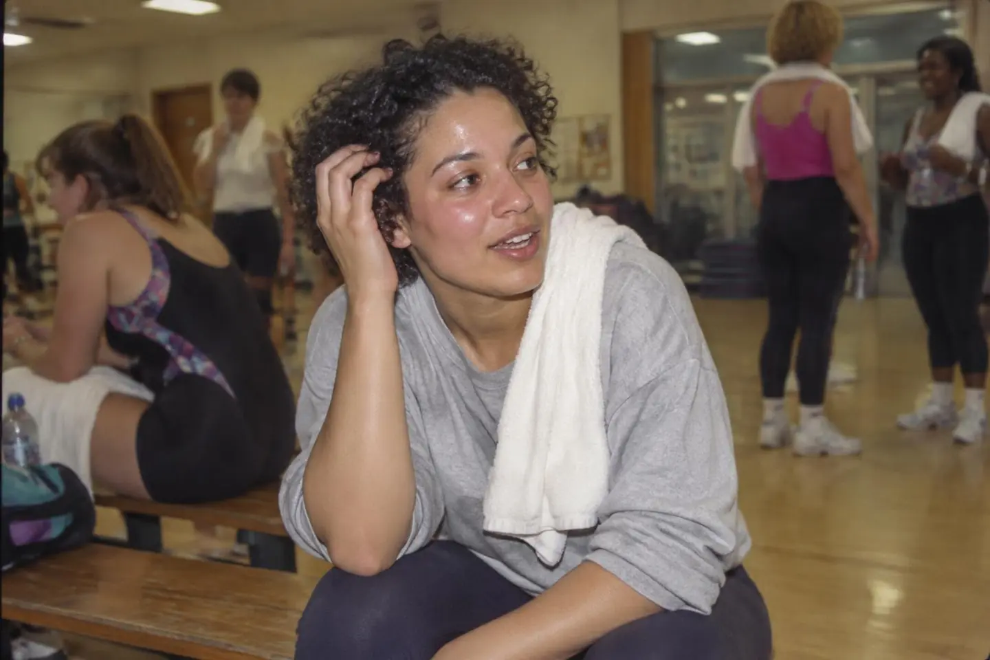 An active woman checking her roots after exercise